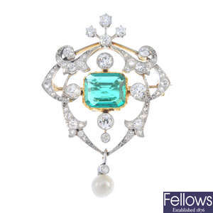 An Edwardian platinum and 18ct gold emerald diamond and natural pearl brooch. 