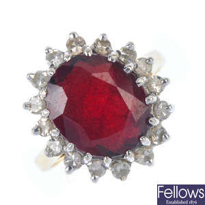 An 18ct gold garnet and diamond cluster ring.