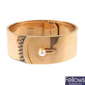 An early 20th century 18ct gold cultured pearl and split pearl bangle.