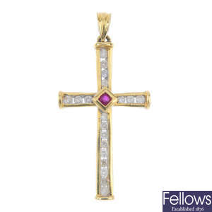 An 18ct gold ruby and diamond cross pendant.