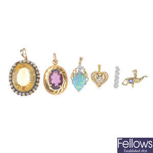 A selection of six gem-set pendants.