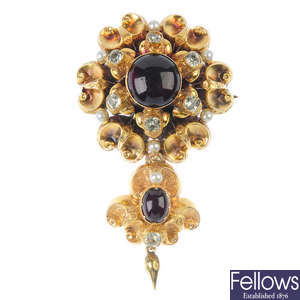 A garnet, gem-set and imitation pearl brooch.