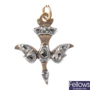 A diamond bird pendant.