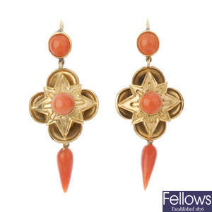 A pair of coral ear pendants.