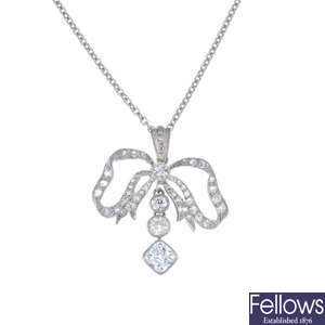 A diamond bow pendant.