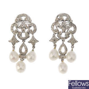 A pair of cultured pearl and diamond ear pendants. 