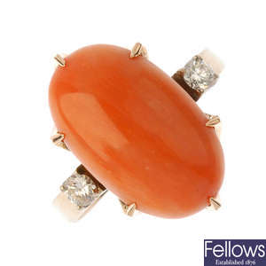 A coral and diamond dress ring.