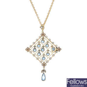 An early 20th century 15ct gold, aquamarine and split pearl pendant.