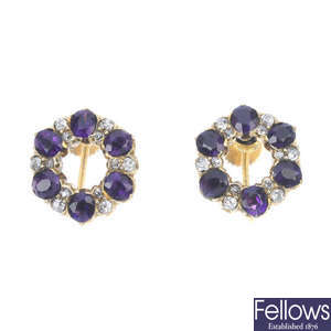 A pair of amethyst and diamond earrings.