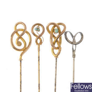 Four early 20th century hat pins, to include two Murrle Bennett & Co. 9ct gold hatpins. 