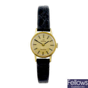OMEGA - a lady's gold plated Geneve wrist watch.