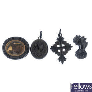Four items of mid to late 19th century jet and vulcanite jewellery.