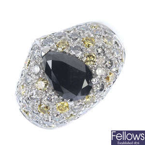 A black gem and diamond dress ring. 