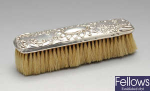 An Edwardian silver mounted clothes brush. 
