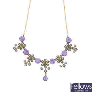 An amethyst, peridot, diamond and seed pearl necklace.