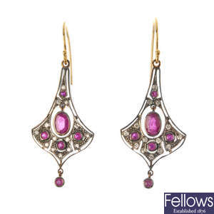 A pair of ruby and diamond ear pendants. 