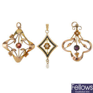 Three Edwardian gold pendants.
