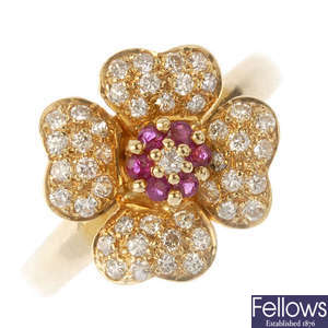 An 18ct gold ruby and diamond floral ring.