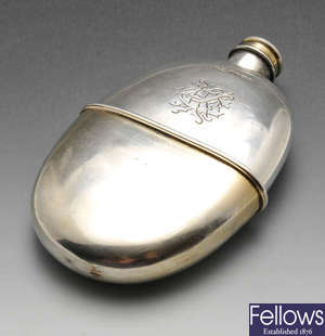 A Victorian silver hip flask.