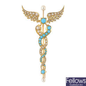 An early 20th century gold turquoise and split pearl caduceus brooch.