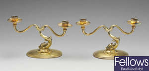 A pair of American silver-gilt twin-branch candelabra. 