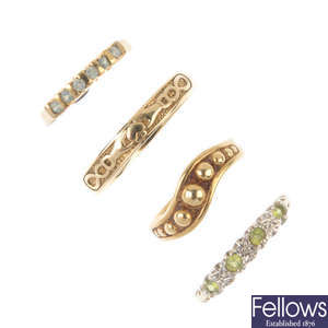 A selection of four 9ct gold rings.