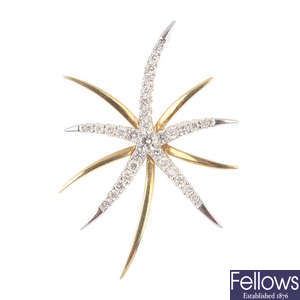 An 18ct gold diamond star pendant.