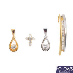 A selection of four diamond pendants.