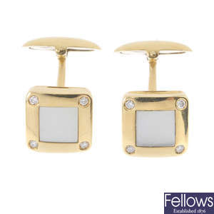A pair of mother-of-pearl cufflinks.