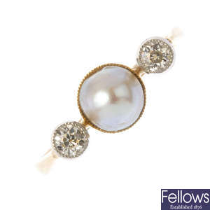 A cultured pearl and diamond three-stone ring.