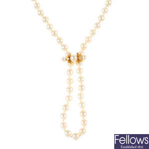 A cultured pearl single-strand necklace with a 9ct gold diamond and cultured pearl enhancer.