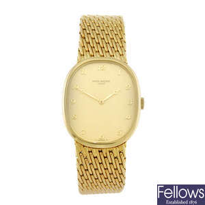 PATEK PHILIPPE - a gentleman's 18ct yellow gold Golden Ellipse bracelet watch. 