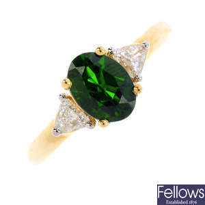 An 18ct gold diopside and diamond three-stone ring.