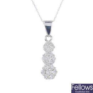 A 14ct gold diamond pendant, with chain.
