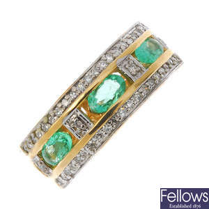A 14ct gold emerald and diamond dress ring.