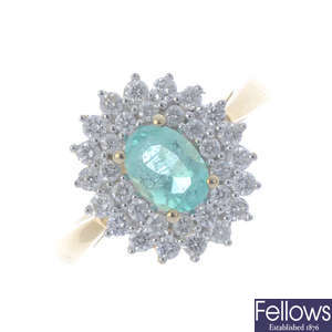 A 14ct gold Colombian emerald and diamond cluster ring.