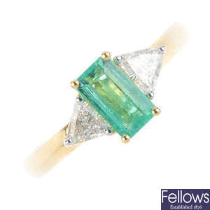 An 18ct gold emerald and diamond three-stone ring.