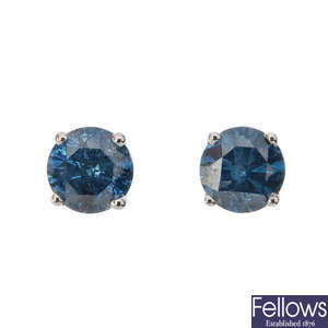 A pair of colour treated 'blue' brilliant-cut diamond ear studs.