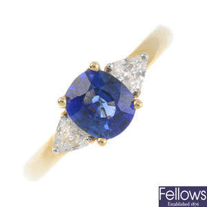 An 18ct gold Ceylon sapphire and diamond three-stone ring.