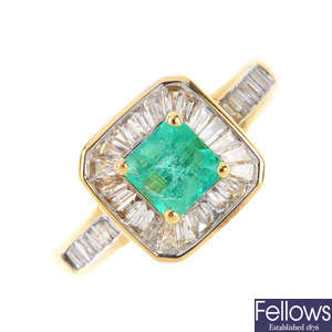An 18ct gold Colombian emerald and diamond cluster ring.