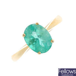 An 14ct gold Colombian emerald single-stone ring.