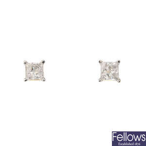 A pair of square-shape diamond single-stone ear studs.