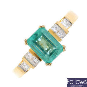 A 14ct gold emerald and diamond ring.