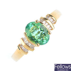 An 18ct gold emerald and diamond dress ring.