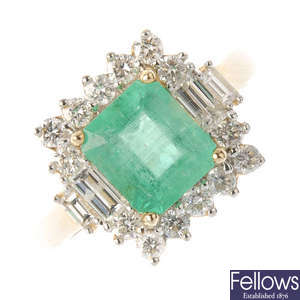 A 14ct gold emerald and diamond cluster ring.