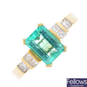 An 18ct gold Colombian emerald and diamond three-stone ring.