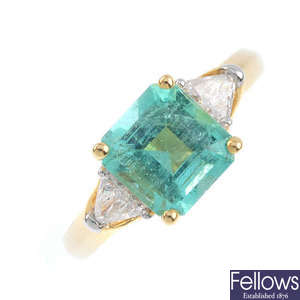 An 18ct gold Colombian emerald and diamond three-stone ring.
