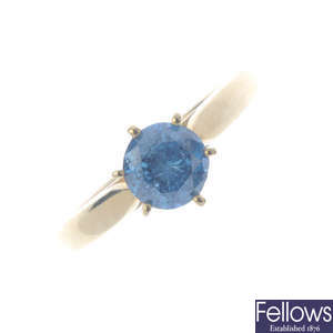 A 14ct gold colour treated 'blue' diamond single-stone ring.