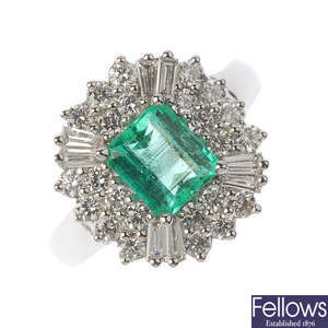 A platinum Columbian emerald and diamond cluster ring.