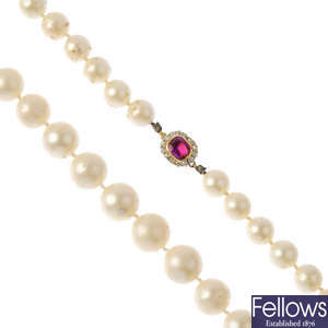 A cultured pearl single-row necklace, with ruby and diamond cluster clasp.